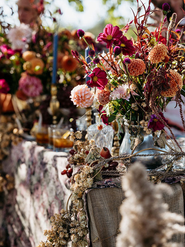 Decorative table setting with flowers and tablecloth