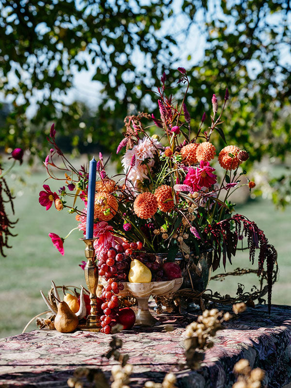 Colourful floral arrangement on an outdoor table.