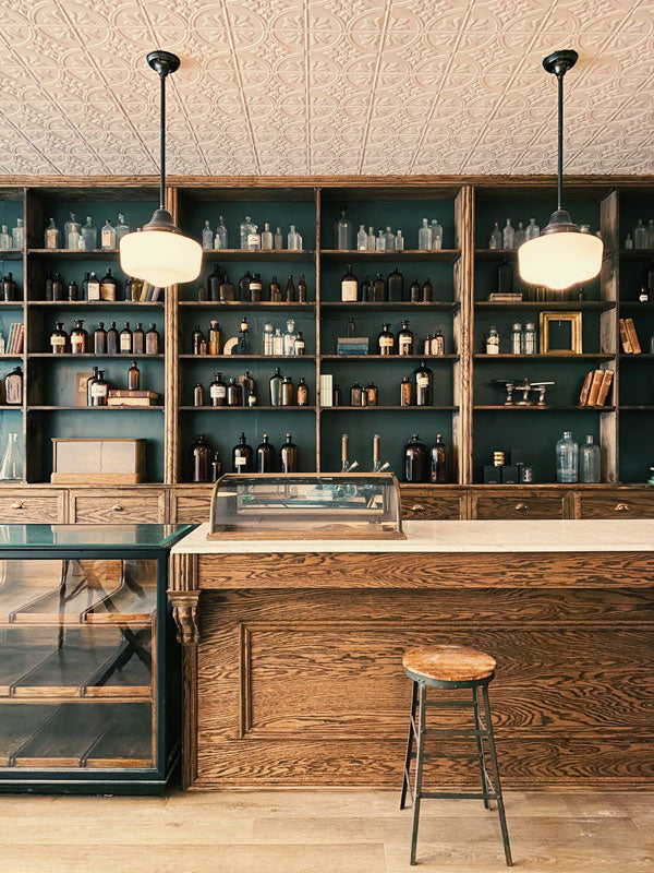Fridays Cannabis interior with wooden counter, shelves, and pendant lights.