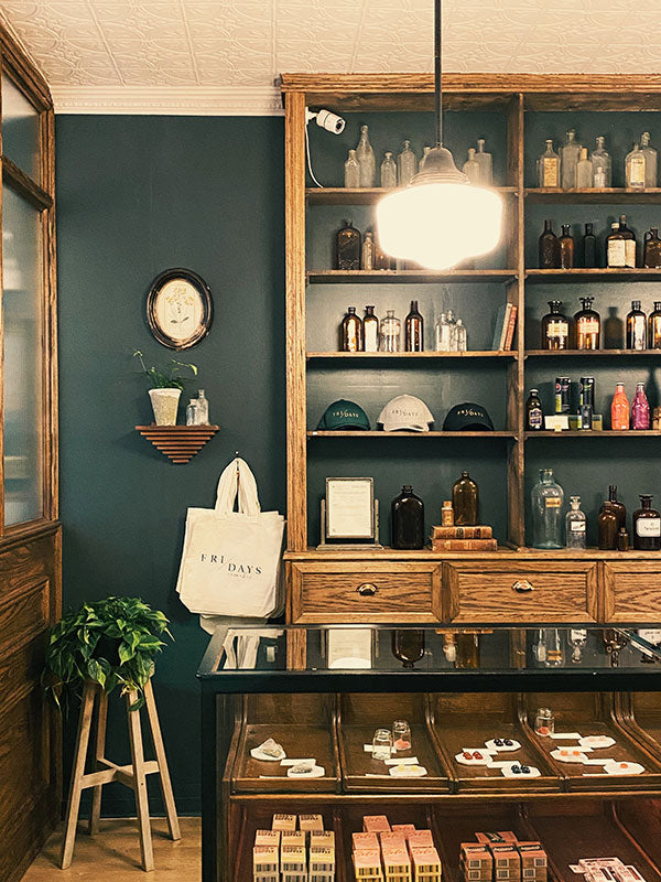 Vintage-style store interior with wooden shelves and display cases.