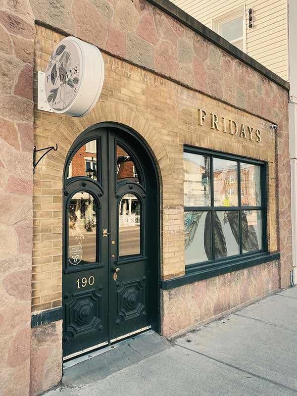 Building exterior with 'Friday's' sign at Fridays Cannabis 